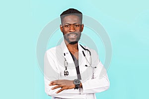 Medicine, profession and healthcare concept. African american male doctor with stethoscope in white coat on blue background