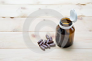 Medicine put on the pallet wood and in the brown glass bottle