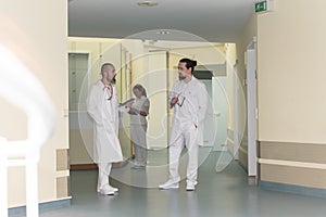 Medicine staff in a hospital is standing in the corridor