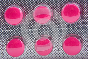 Medicine strip with pink pills