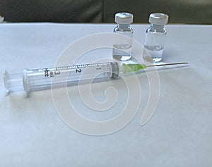 Medicine, Syringe and vacine botte medical tools in time corona virus covid 19 pandemic