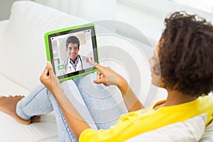 Patient having video chat with doctor on tablet pc