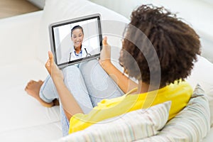 Patient having video chat with doctor on tablet pc