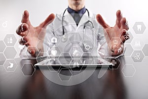 Medicine technology and healthcare concept. Medical doctor working with modern pc. Icons on virtual screen.