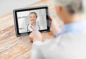 Senior woman patient having video call with doctor