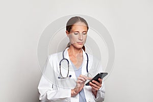 Medicine, technology and healthcare concept. Successful attractive mid adult woman doctor medical worker or nurse holding