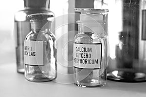 Medicine vintage Bottles with pyridoxin chemicals at pharmacy shelf. Chemical laboratory Glassware and flasks for scientific tests