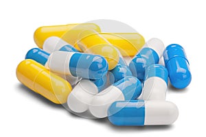Medicine yellow and blue pills on isolated white background