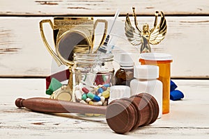 Medicines, awards and hammer.