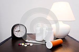 Medicines, clock and lamp