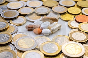 Medicines with coins around them