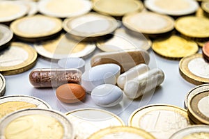 Medicines with coins around them