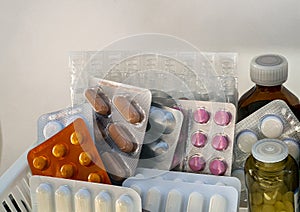 Medicines in packages, blisters and bottles are on the shelf. Medical background for pharmacies, hospitals, clinics.