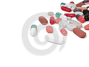 Mediciones,capsules,tablets scattered on white isolated photo