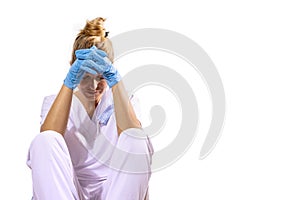 Medico girl defeated after a long day at the hospital. White background photo