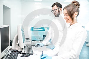 Medics configuring analyzer machine