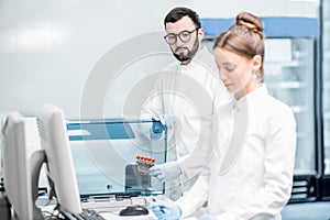 Medics configuring analyzer machine