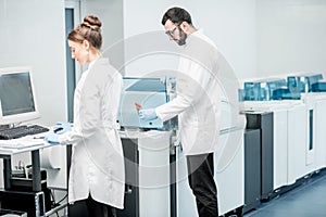 Medics configuring analyzer machine