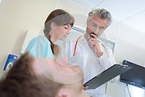 Medics looking at patient`s notes