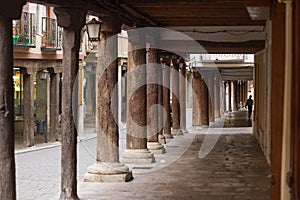 Medieval arcades with wooden columns in Spanish city