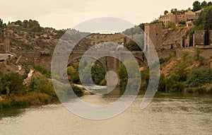 Medieval arch bridge on the Tagus River in Toledo City, Spain