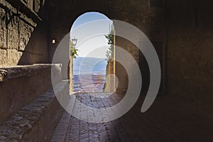 Medieval arched door in the old town of Pienza