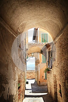 Medieval arched street in the old town of Montepulchano, Italy