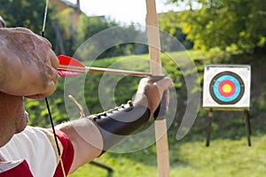 Medieval archer shoot at a target