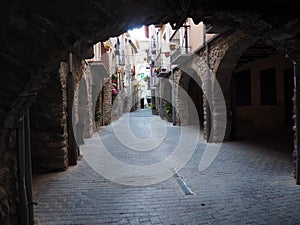 medieval arches in the main street of pont de suert, lerida, spain, europe