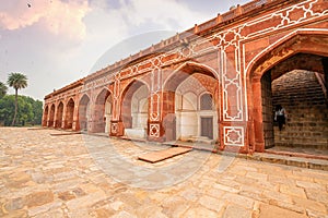 Medieval architecture made of red sandstone and marble at Humayun Tomb Delhi India at sunset