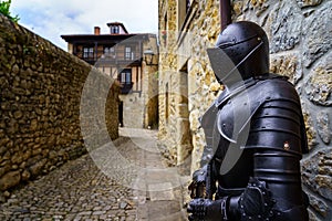 Medieval armor of a knight, in an old stone town street in northern Spain