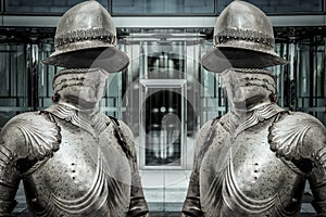 Medieval armor protecting a business building. Concept of firewall protection