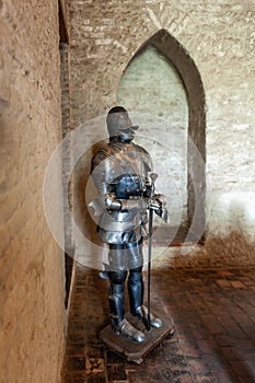 Medieval armor with sword in a castle