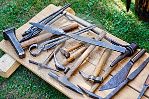 Medieval blacksmith shop. Tools and weapons for sale