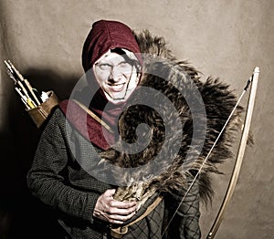 Medieval bowman. Studio shot photo