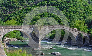 The medieval  bridge of Echallod in Arnad,  over the river  dora baltea in Aosta Valley/Italy