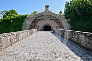 Medieval bridge leading up to the Marienberg castle in Wuerzburg on a sunny day