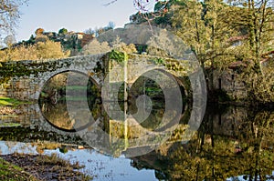 Medieval stone bridge over the Arnoia river in Allariz. Province of Ourense. Galicia, Spain photo