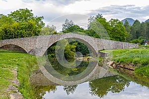 Medieval bridge over the Rialsesse river in Serres, France photo