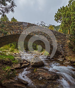 Medieval bridge over the Riu de la Coma river photo