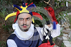 Medieval buffoon with a puppet