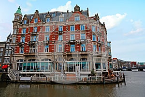 Medieval building along the river Amstel in Amsterdam Netherlands