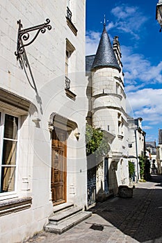 Medieval buildings with tower on the street. Rue Haute Saint-Maurice, Chinon, France