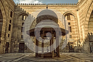 Medieval Cairo's mosque-madrasa with intricate decorations and architectural features photo