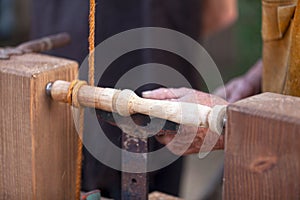 Medieval carpenter doing woodturning