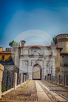 Medieval castle of Brescia city with a winged lion that holds a book