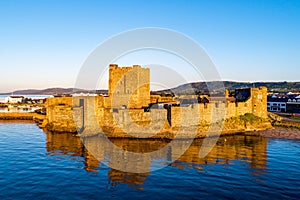 Medieval castle in Carrickfergus near Belfast at sunrise