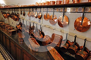 Medieval castle kitchen with old copperware.