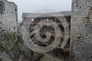 Medieval castle ruin courtyard in heavy fog