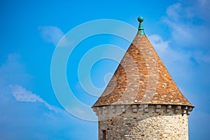 Medieval castle tower close-up roof over sky, Blandy-les-Tours